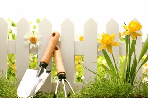 Professional designing a garden layout in Chislehurst